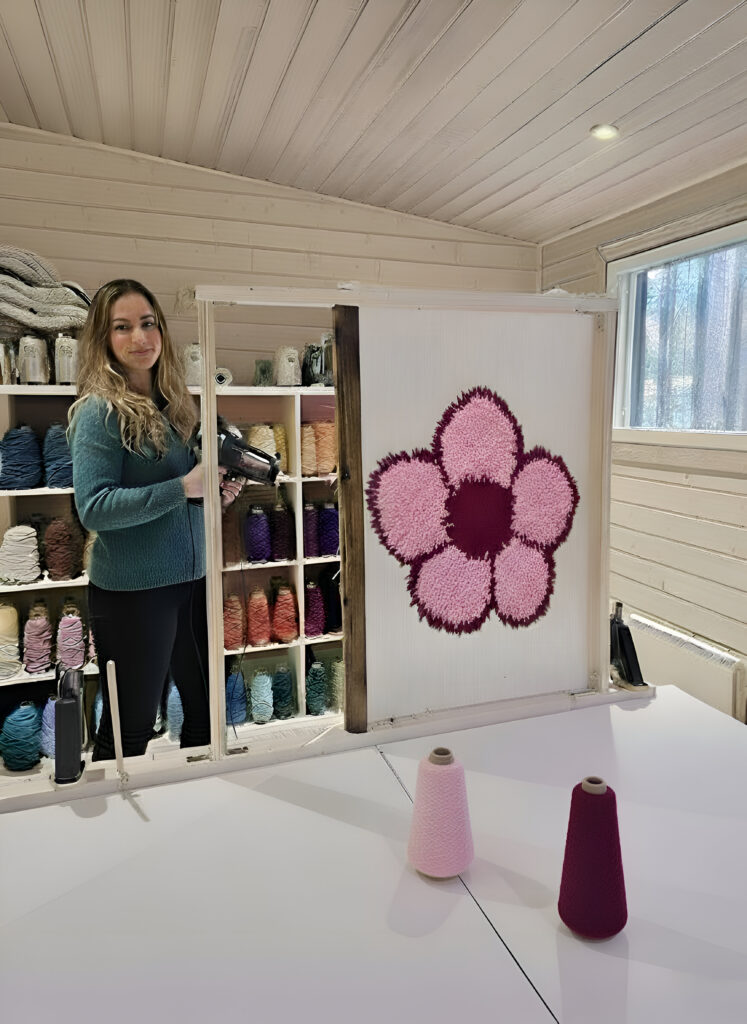 tufting workshop - participant with her flower rug